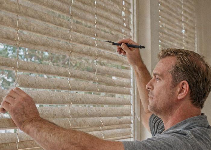 James Carman working with blinds